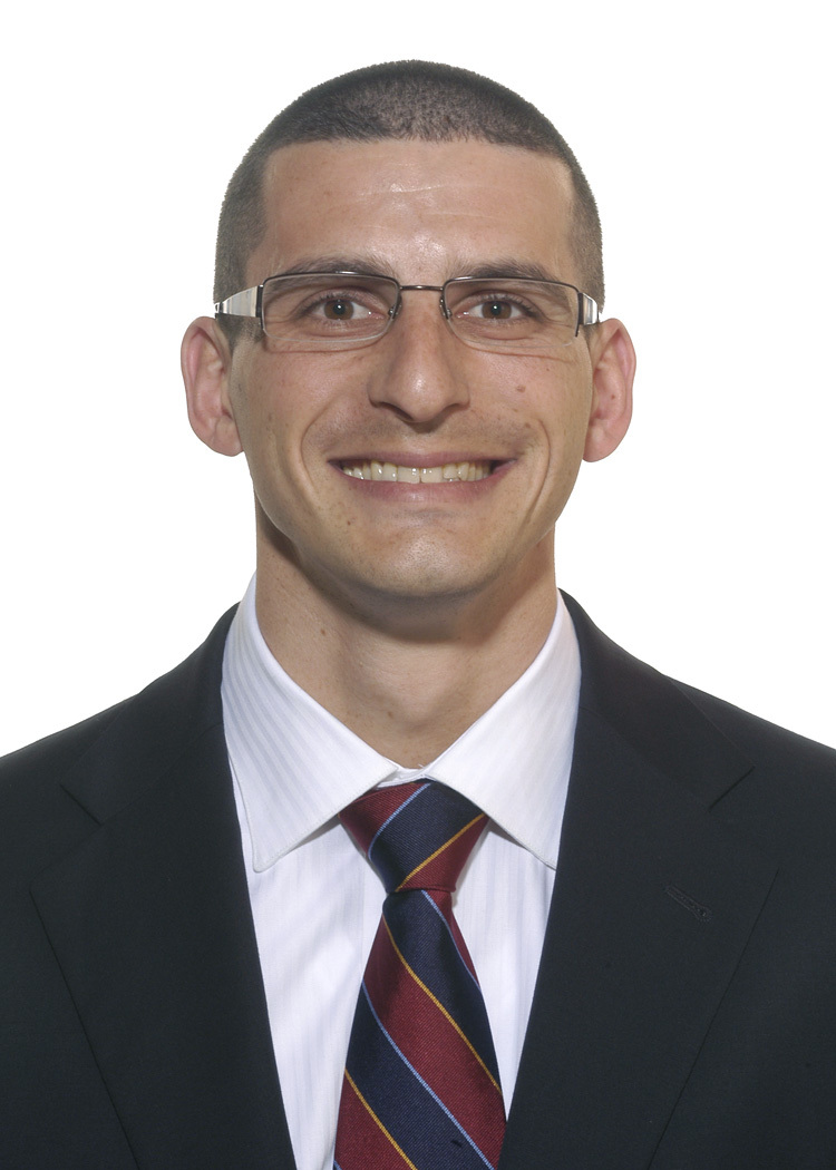 Headshot of a man in a striped tie